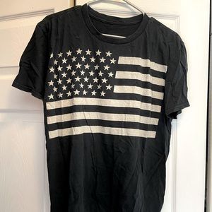 Black t-shirt with white American flag on the front. Mens size large. Very soft.
